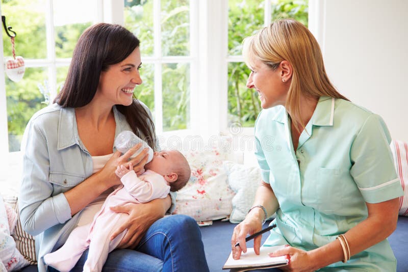 Mother With Baby Meeting With Health Visitor At Home royalty free stock photography Mother With Baby Meeting With Health Visitor At Home royalty free stock photography