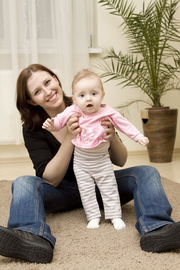 Mother and baby playing at home