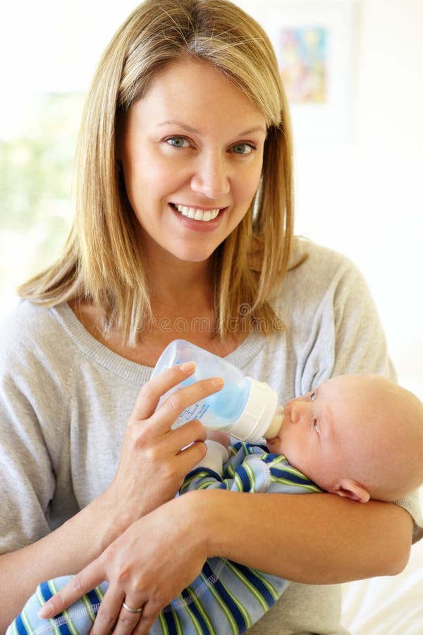 Mother Bottlefeeding Her Seven Month Old Baby Stock Image Image of child, home 10749131