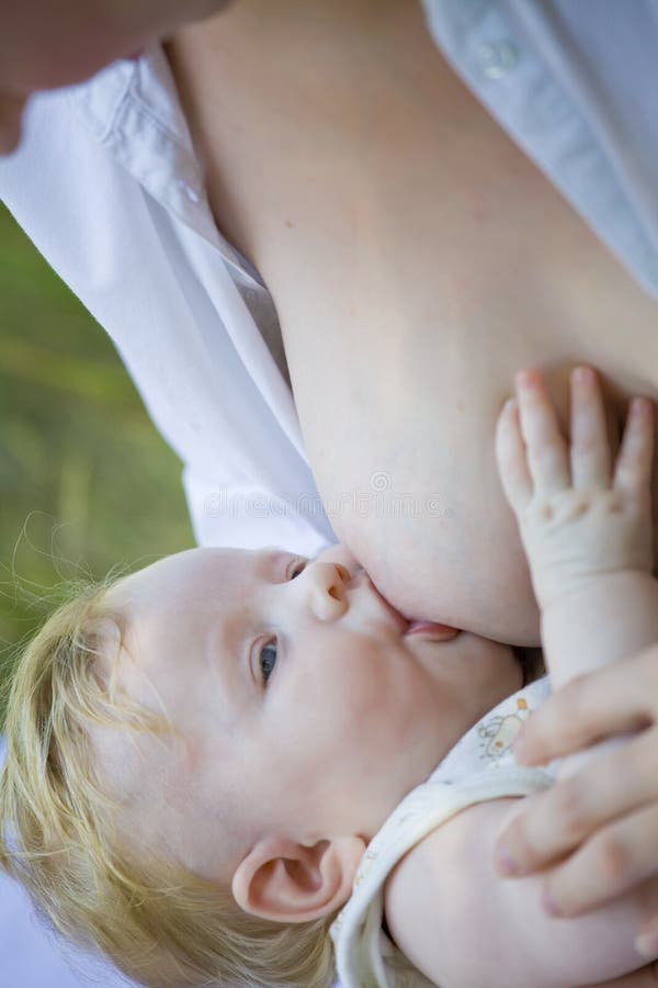 Mother breast feeding her baby