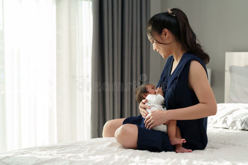 Mother Breastfeeding Newborm Baby on Bed Stock Image Image of feed