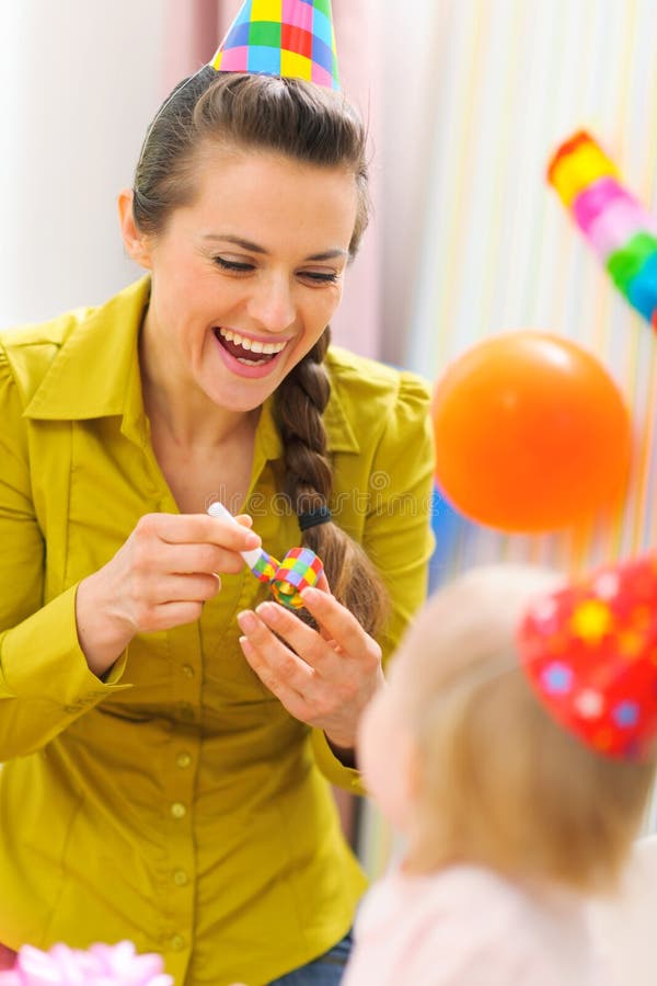Mother celebrating first birthday of her baby. Mother celebrating first birthday of her kid royalty free stock photo Mother celebrating first birthday of her baby. Mother celebrating first birthday of her kid royalty free stock photo