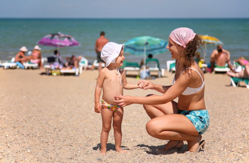 Mother and child on a beach stock image