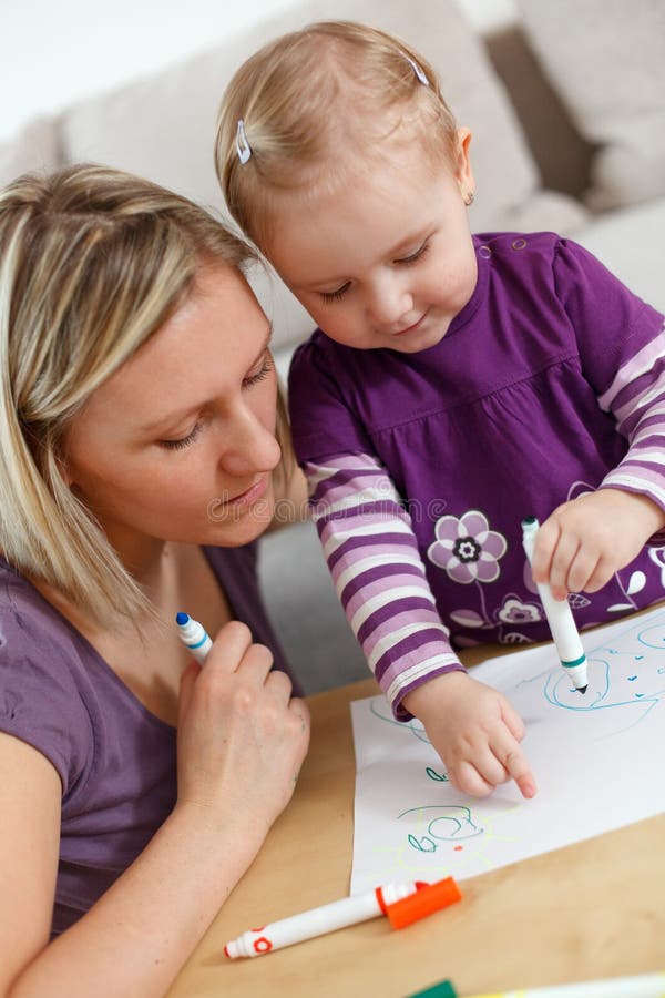 Mother and child drawing stock photo