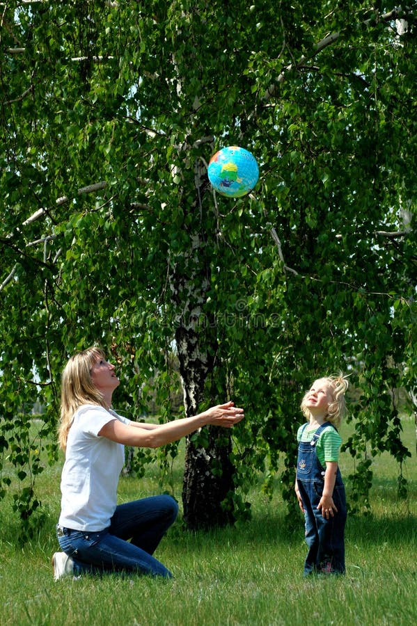 Mother and child play with ball