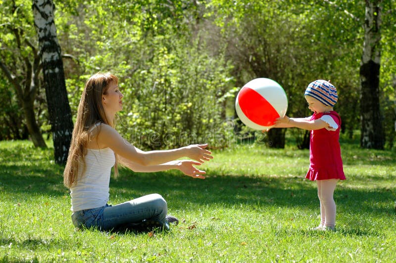 Mother and child play with ball