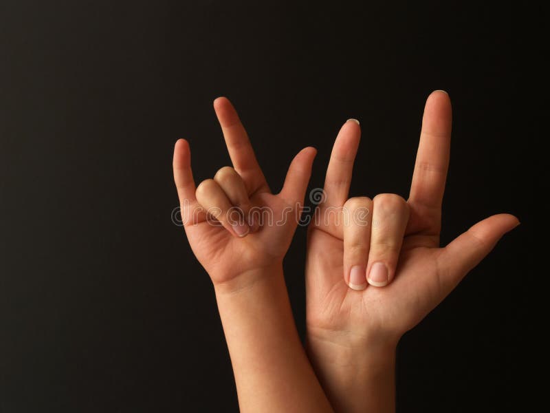 A mother and her child doing sign language for I LOVE YOU. A mother and her child doing sign language for I LOVE YOU