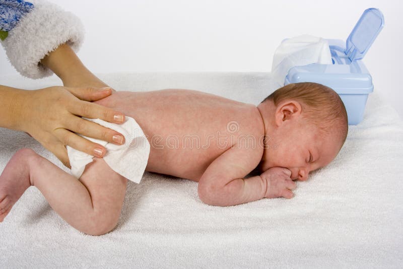 Mother cleaning baby s skin