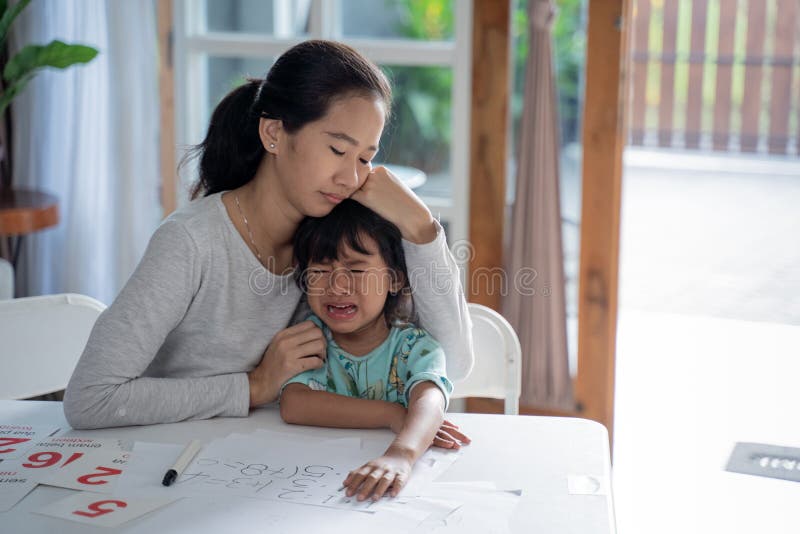 Mother comfort her crying daugther at home royalty free stock photo Mother comfort her crying daugther at home royalty free stock photo