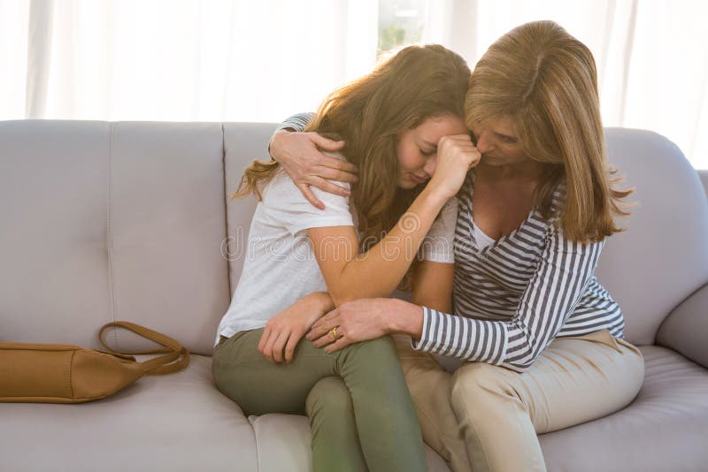 Mother comforting her teenage daughter