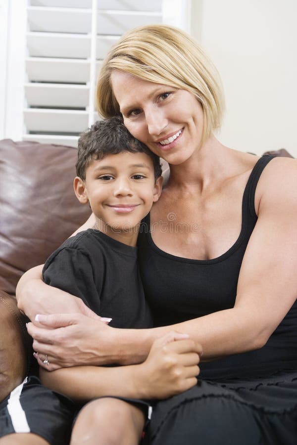 Mother cuddling her son royalty free stock photos 