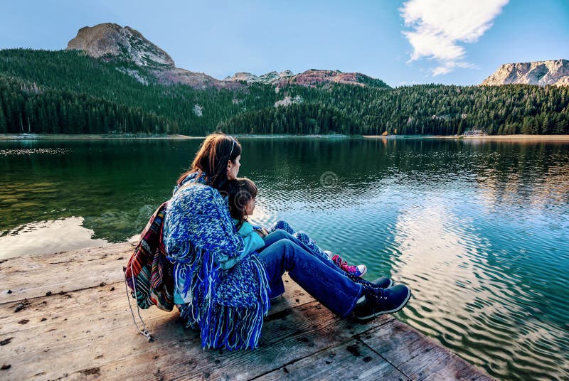 Mother and daughter admiring beautiful panorama of Black Lake (