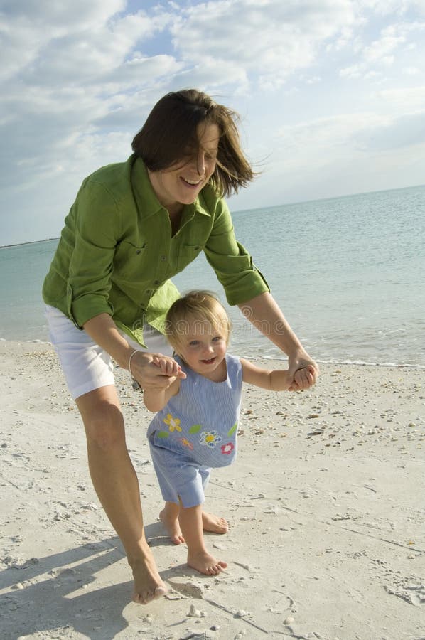 Mother and daughter at beach royalty free stock photos Mother and daughter at beach royalty free stock photos