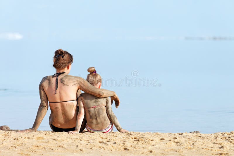Group of moms nude on beach