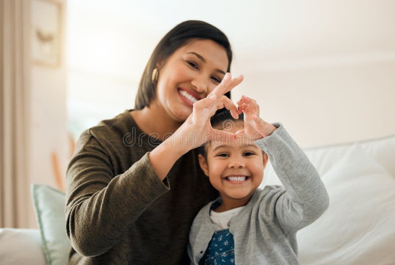 A Mother And Daughter Bond Is Like No Other Shot Of A Young Mother And Son Making A Heart 