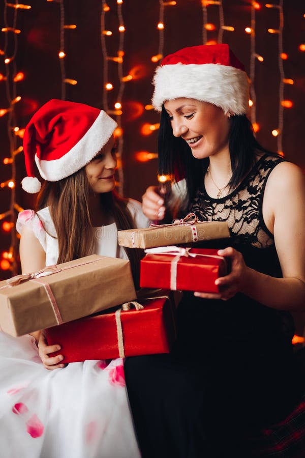 Mother And Daughter With Christmas Presentschristmas Ts Against 