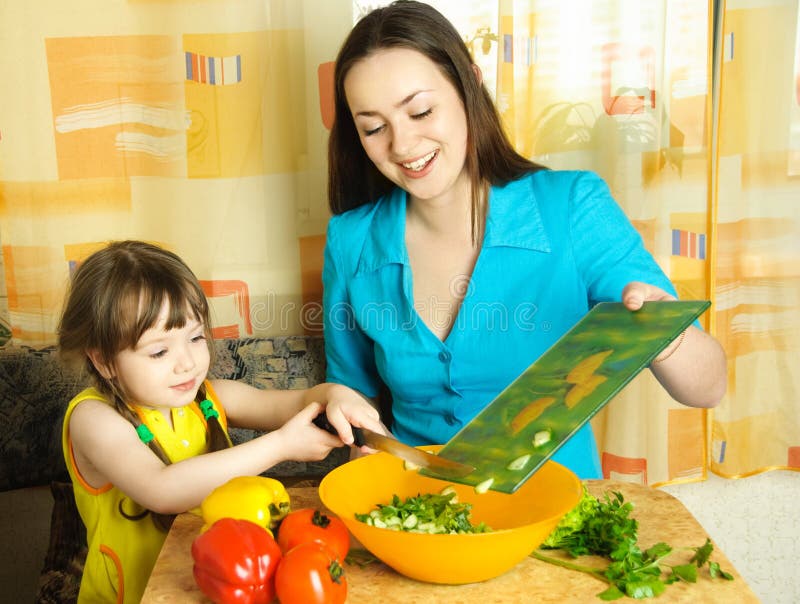 Mother and daughter cooking together