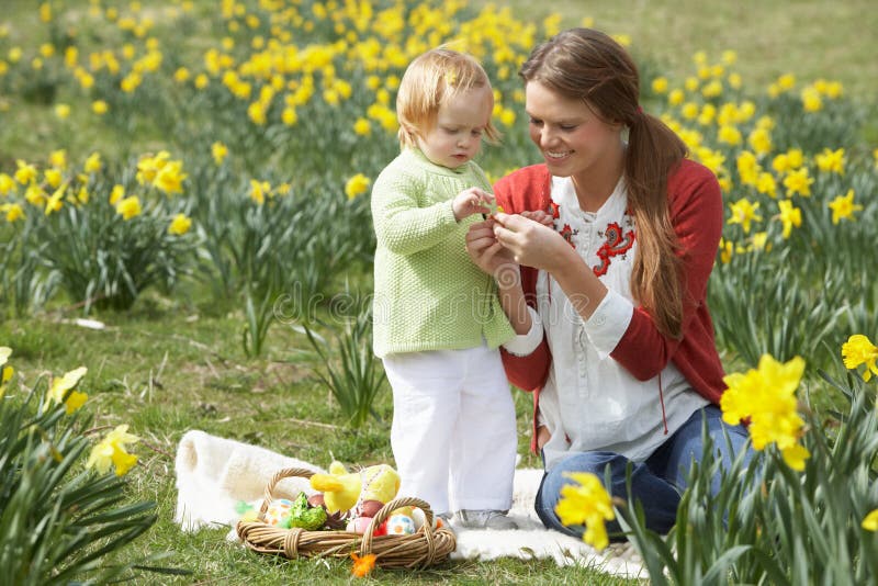 Mother And Daughter With Decorated Easter Eggs stock images
