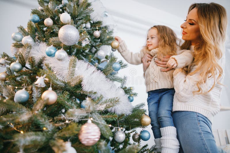 Mother and Daughter Decorating the Tree Stock Photo - Image of ...