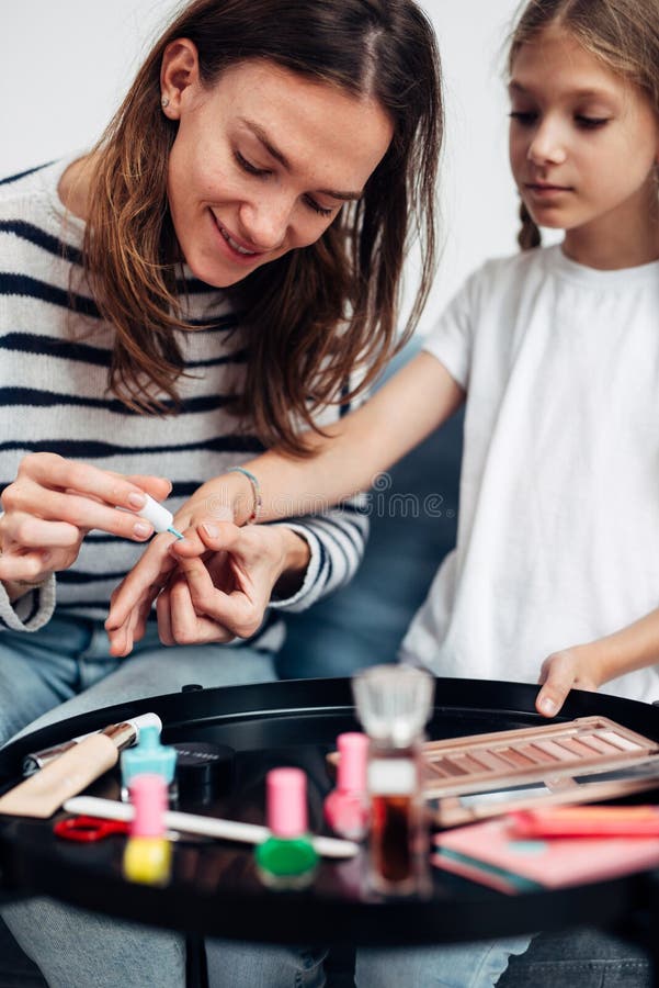 Mother and daughter doing manicure Stock Photo by ©iakovenko123 114021060