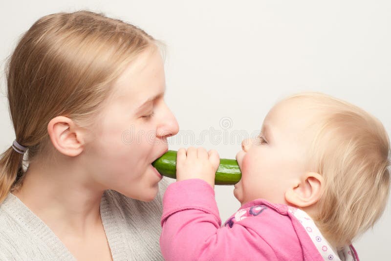 Mother With Daughter Eat Cucumber Stock Image Image of happiness