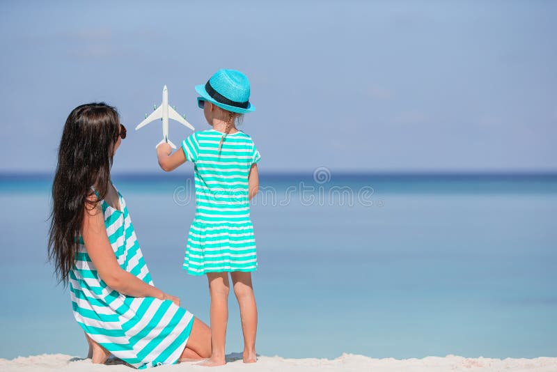 Beautiful Mother And Daughter At Caribbean Beach Enjoying Summer 