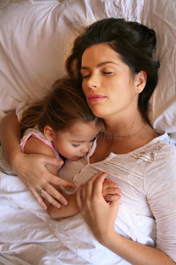 Mother Tucking Her Child on Christmas Eve Stock Photo - Image of caring