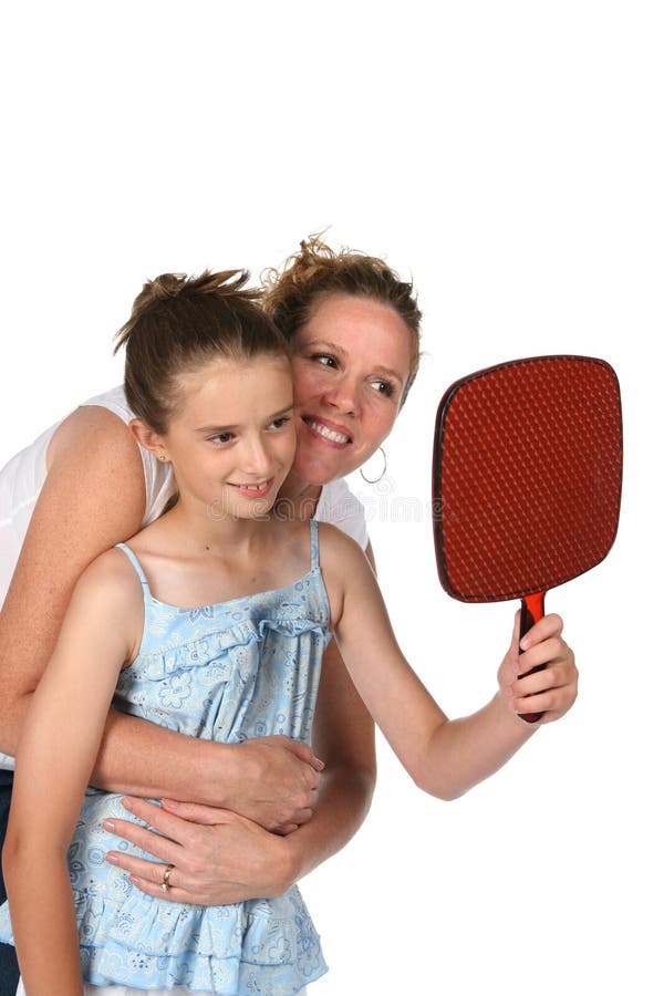 Mother and daughter looking in mirror