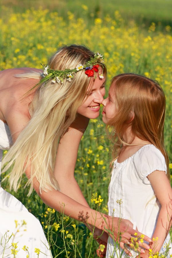 Mother and daughter on nature