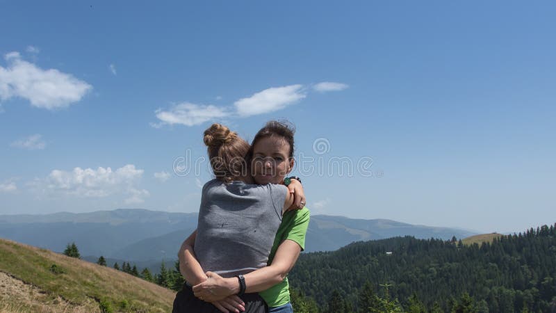 Mother with daughter outdoors hugging - stop motion animation