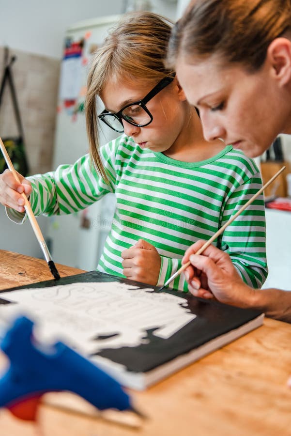 Mother And Daughter Painting Canvas Stock Image - Image of classroom