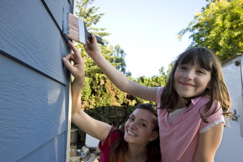 Mother and Daughter Painting a House - Horizontal