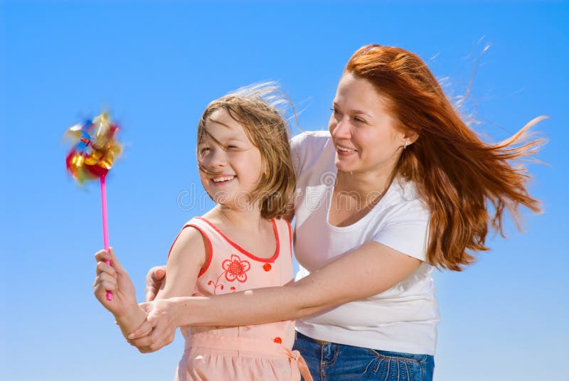 Mother and daughter with pinwheel