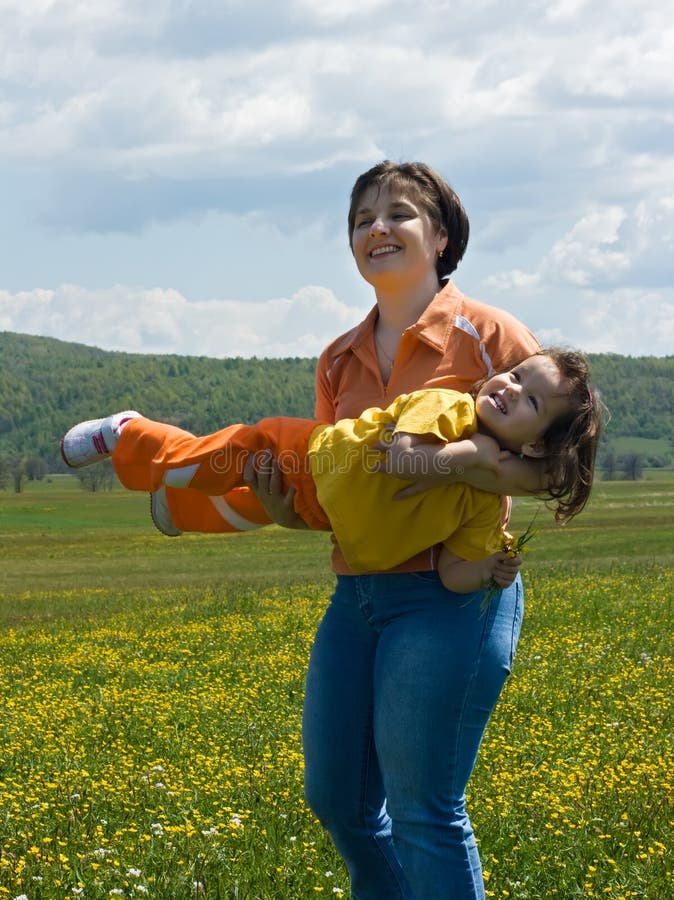 Mother and daughter playing outside