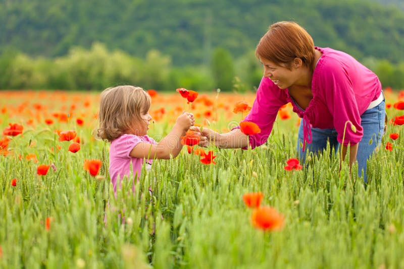 Mother and daughter in poppy field royalty free stock images Mother and daughter in poppy field royalty free stock images