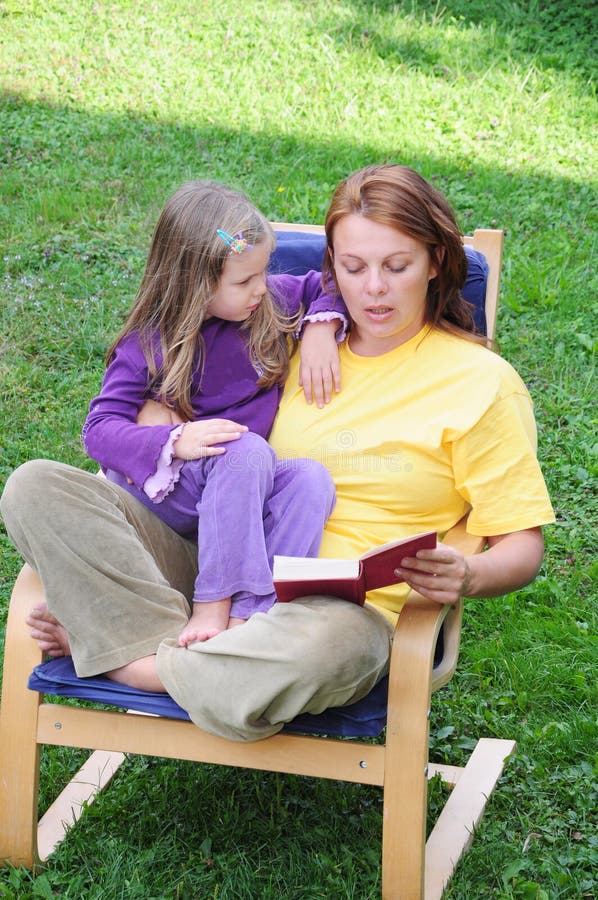 Mother and daughter reading a book