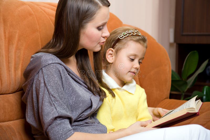 Mother and daughter reading book