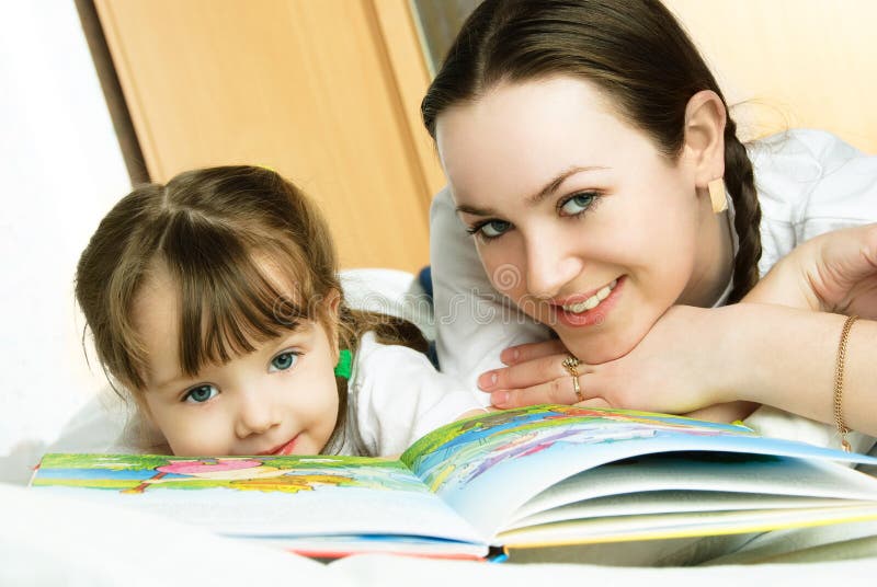 Mother and daughter reading a book