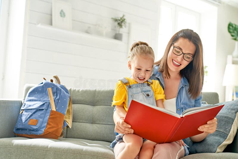 Mother and daughter are reading a book royalty free stock photo Mother and daughter are reading a book royalty free stock photo