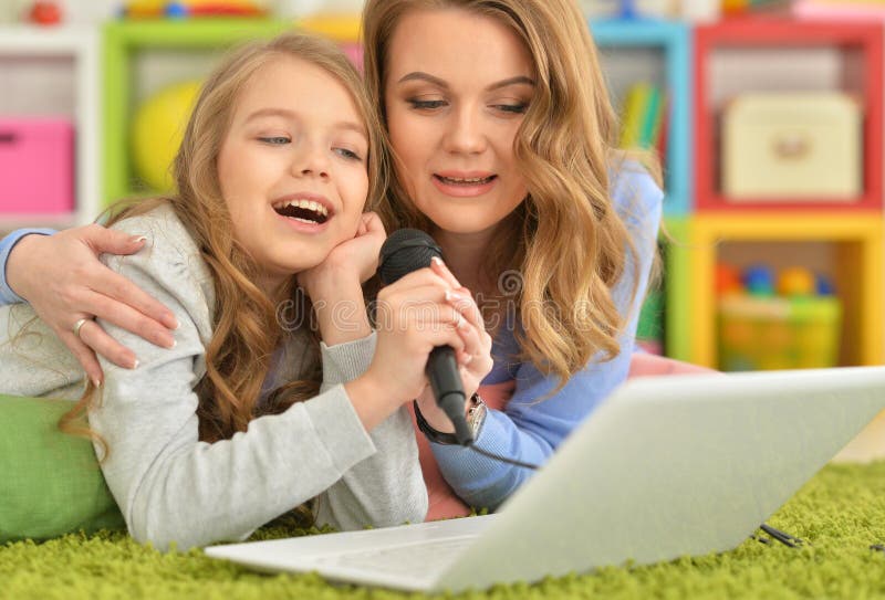 Mother and Daughter Singing Karaoke Stock Image Image of microphone
