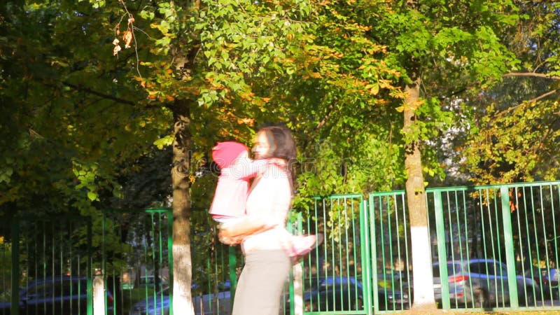 Mother and daughter in the summer park