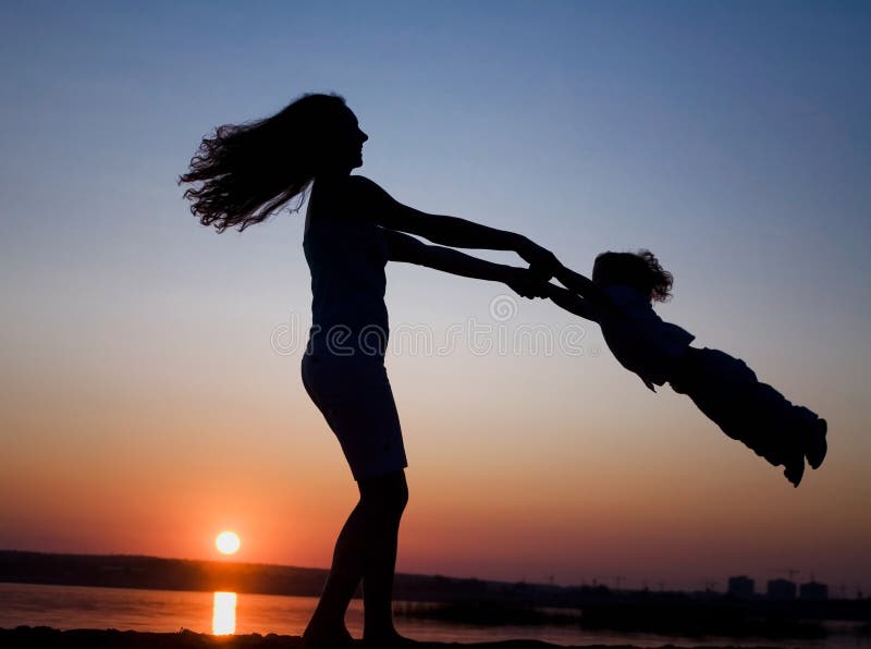 Mother and daughter on sunset royalty free stock photos