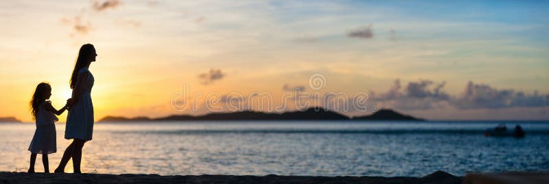 Mother and daughter at sunset