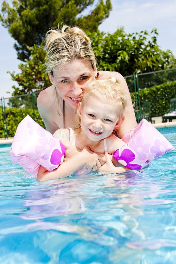 Mother and daughter in swimming pool