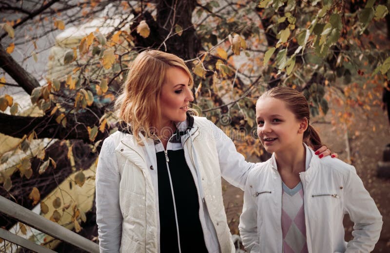 Mother with daughter talking.