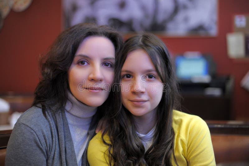 Portrait of mother and daughter teenager