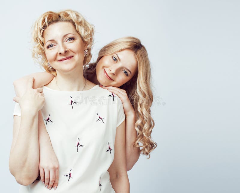 Mother with daughter together posing happy smiling isolated on white background with copyspace, lifestyle people concept