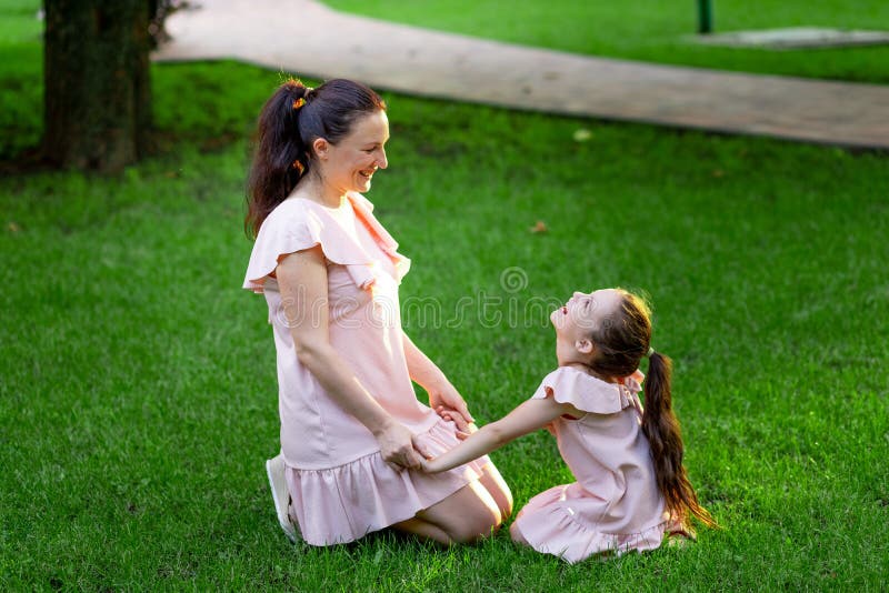 Mother And Daughter 5 6 Years Old Walking In The Park In The Summer Daughter And Mother 