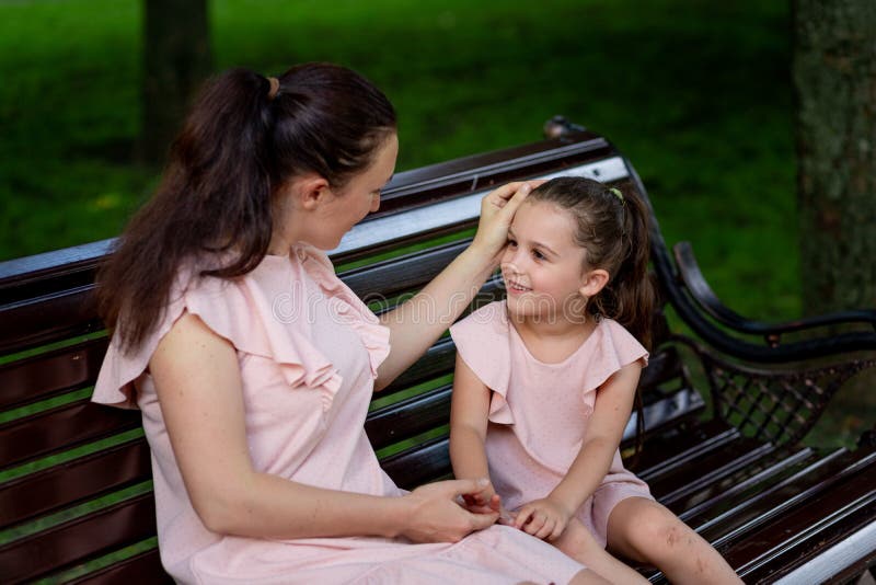 Mother And Daughter 5 6 Years Old Walking In The Park In The Summer Mother Talking To Her 