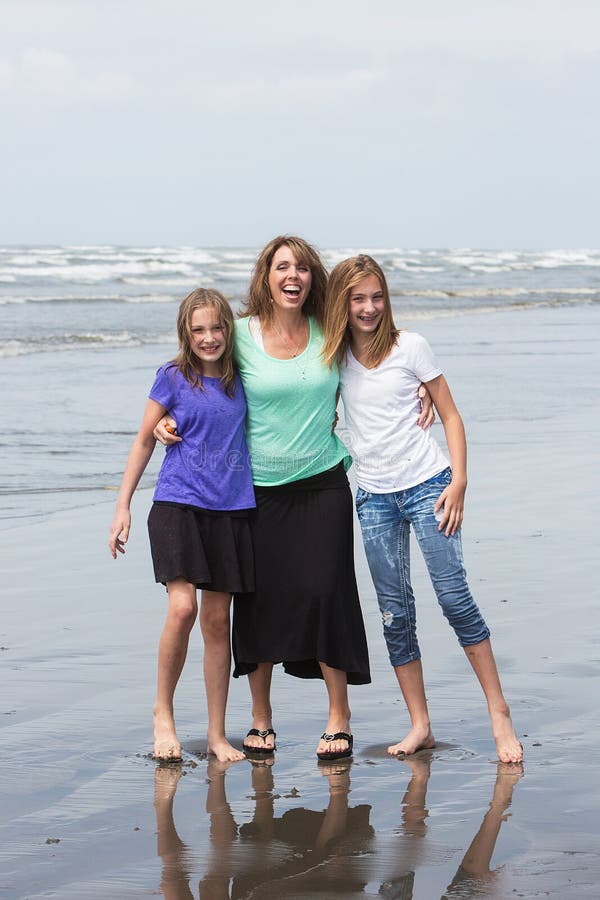 Mother and Daughters at the Beach stock images Mother and Daughters at the Beach stock images